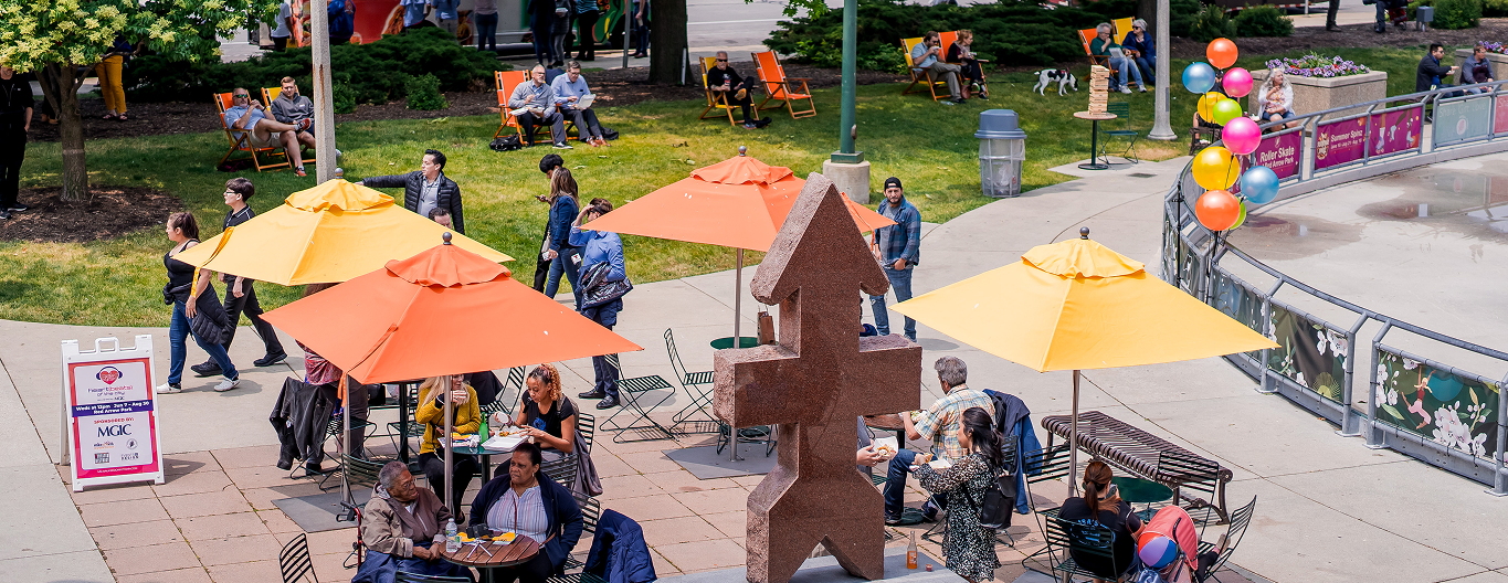 Folks eating lunch at Red Arrow Park.