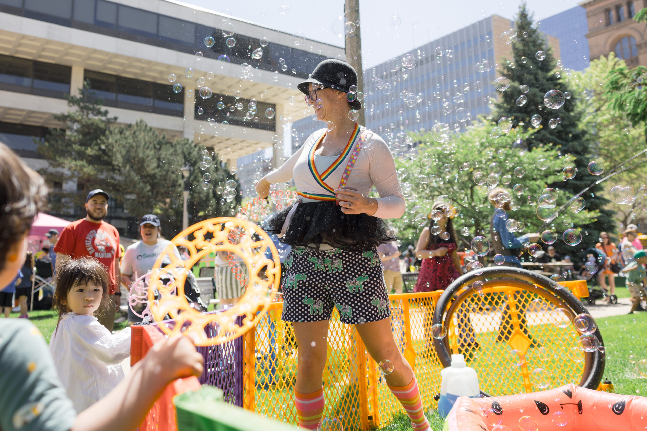 A woman dances at an outdoor event.