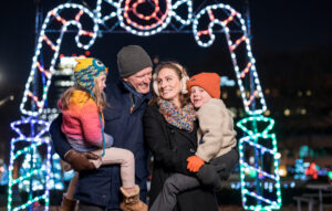 A family of four at the Holiday Lights Festival.