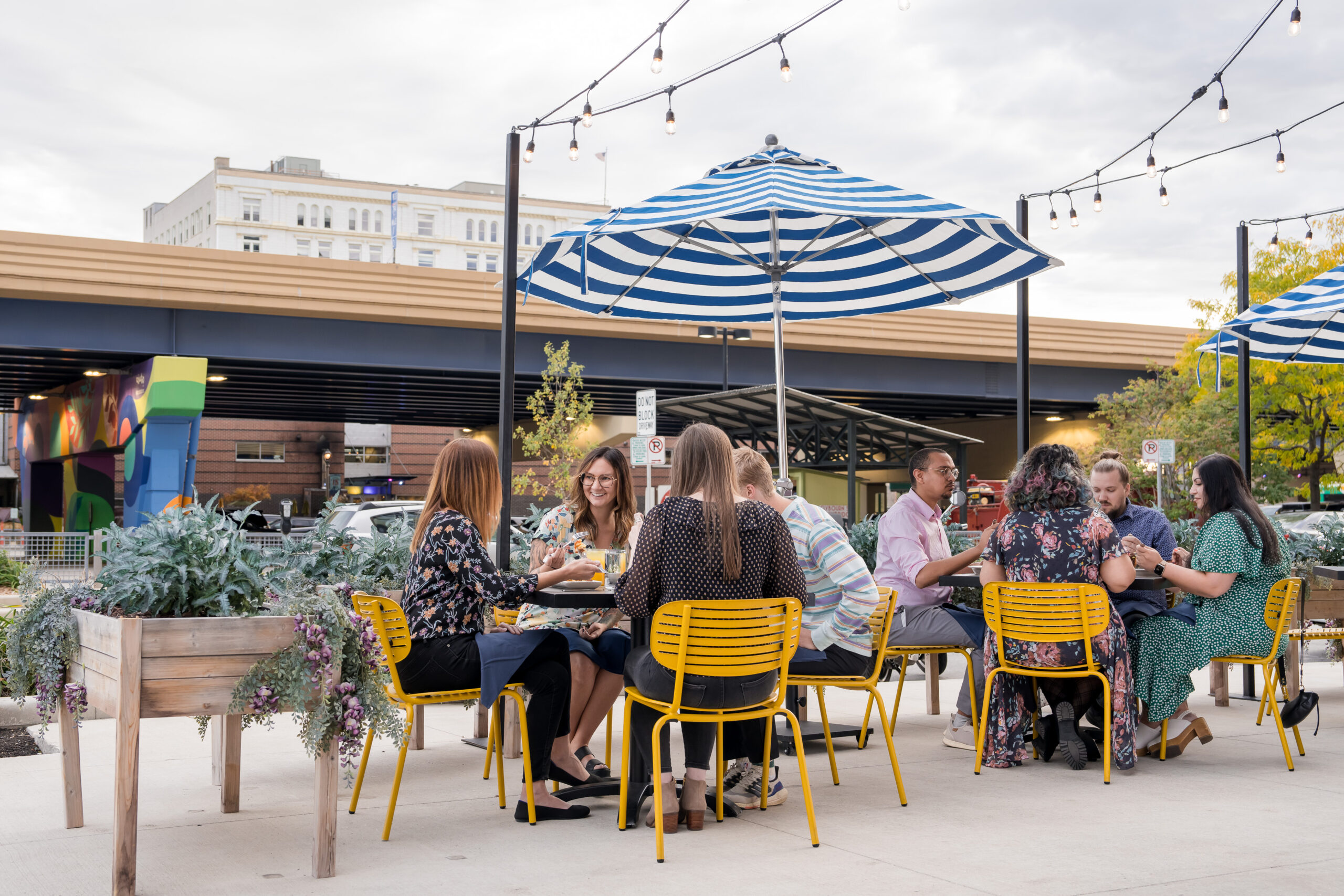 A group of diners eat outside.