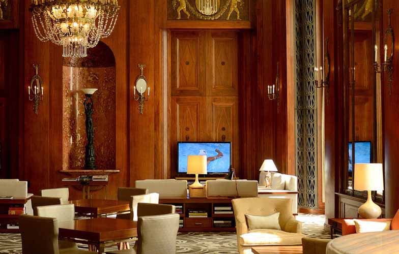 The Hilton City Center lobby features wood paneled walls and lots of seating.